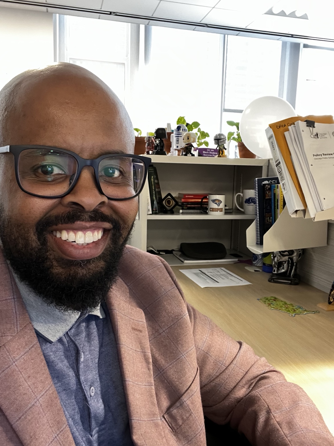 Dr. Noel Greenwood working in a policy leadership office